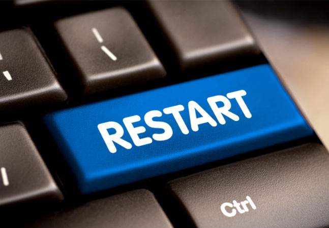 blue Restart button on the black keyboard.