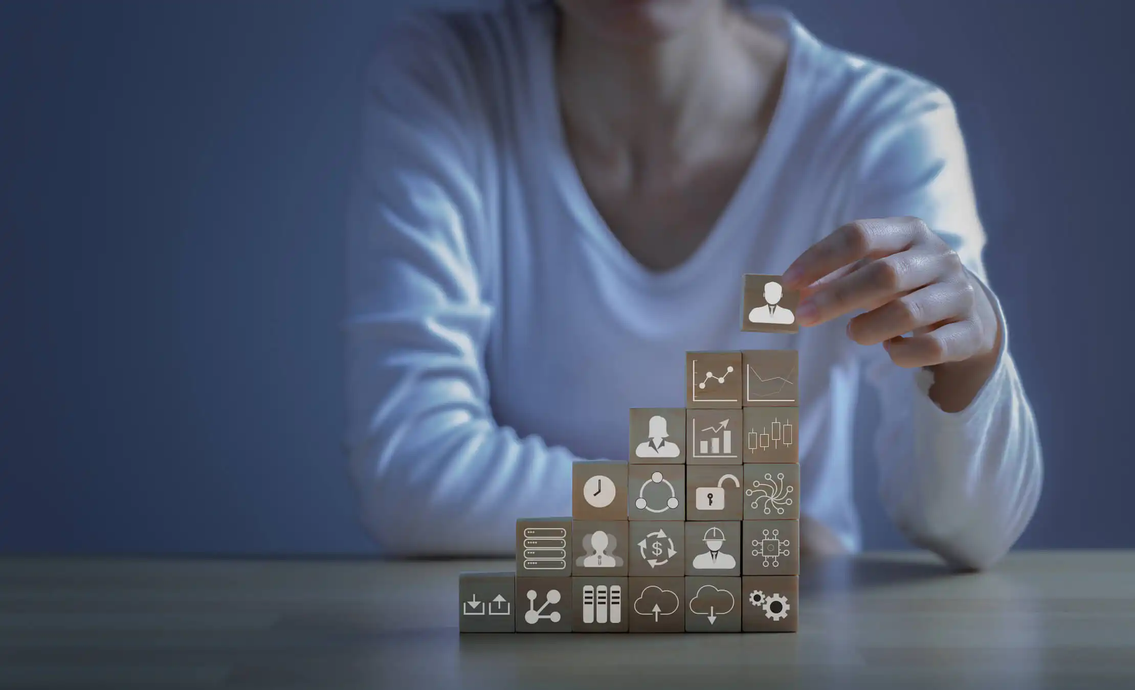 women building cubes with the IT signs on them